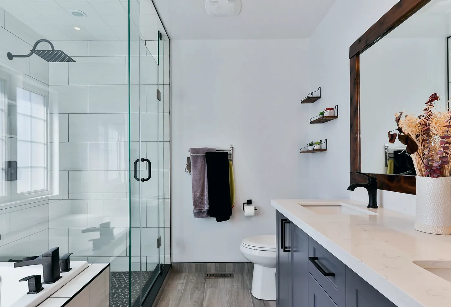 Modern bathroom with glass shower, vanity and tile work