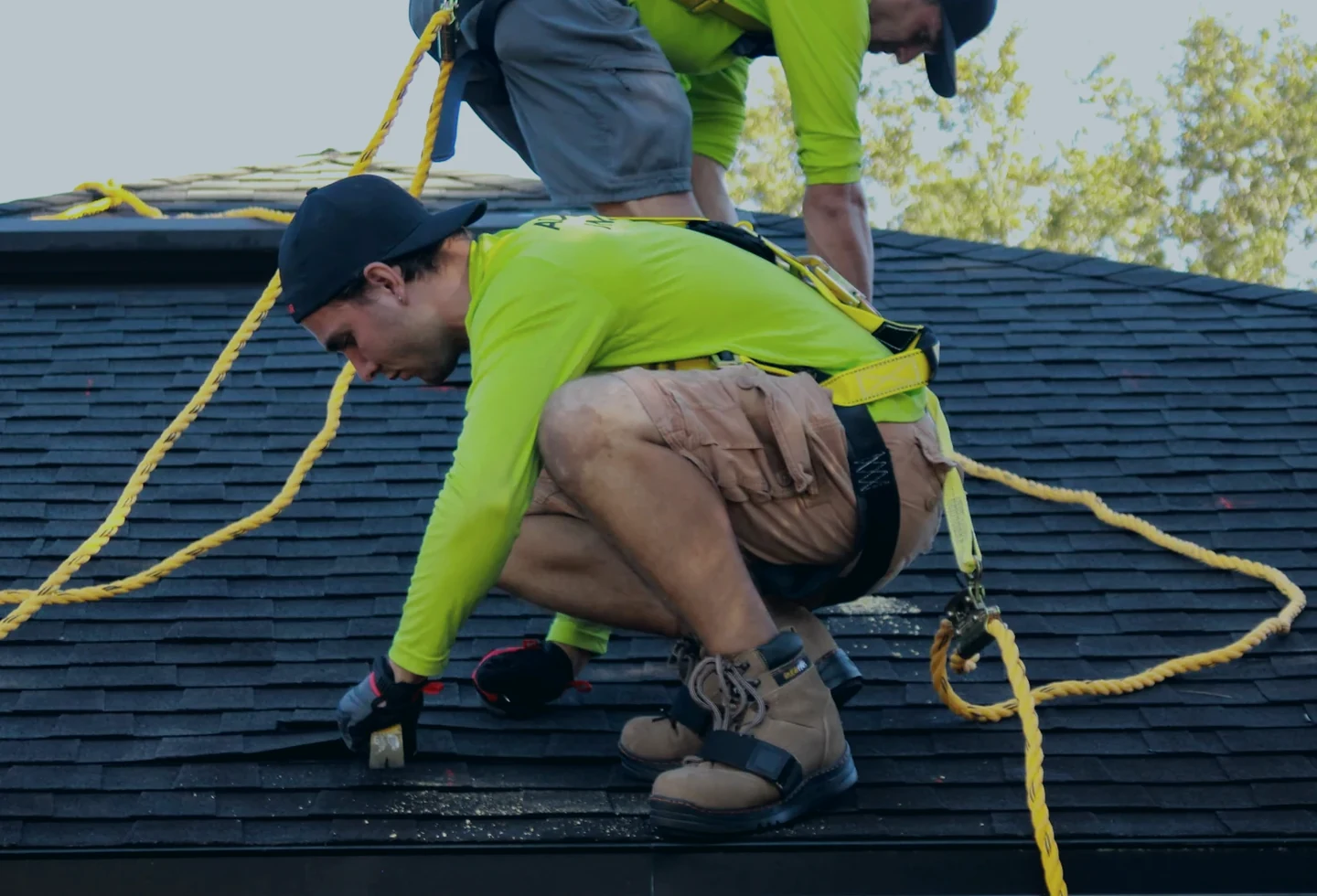 Roofing crew working on a residential roof